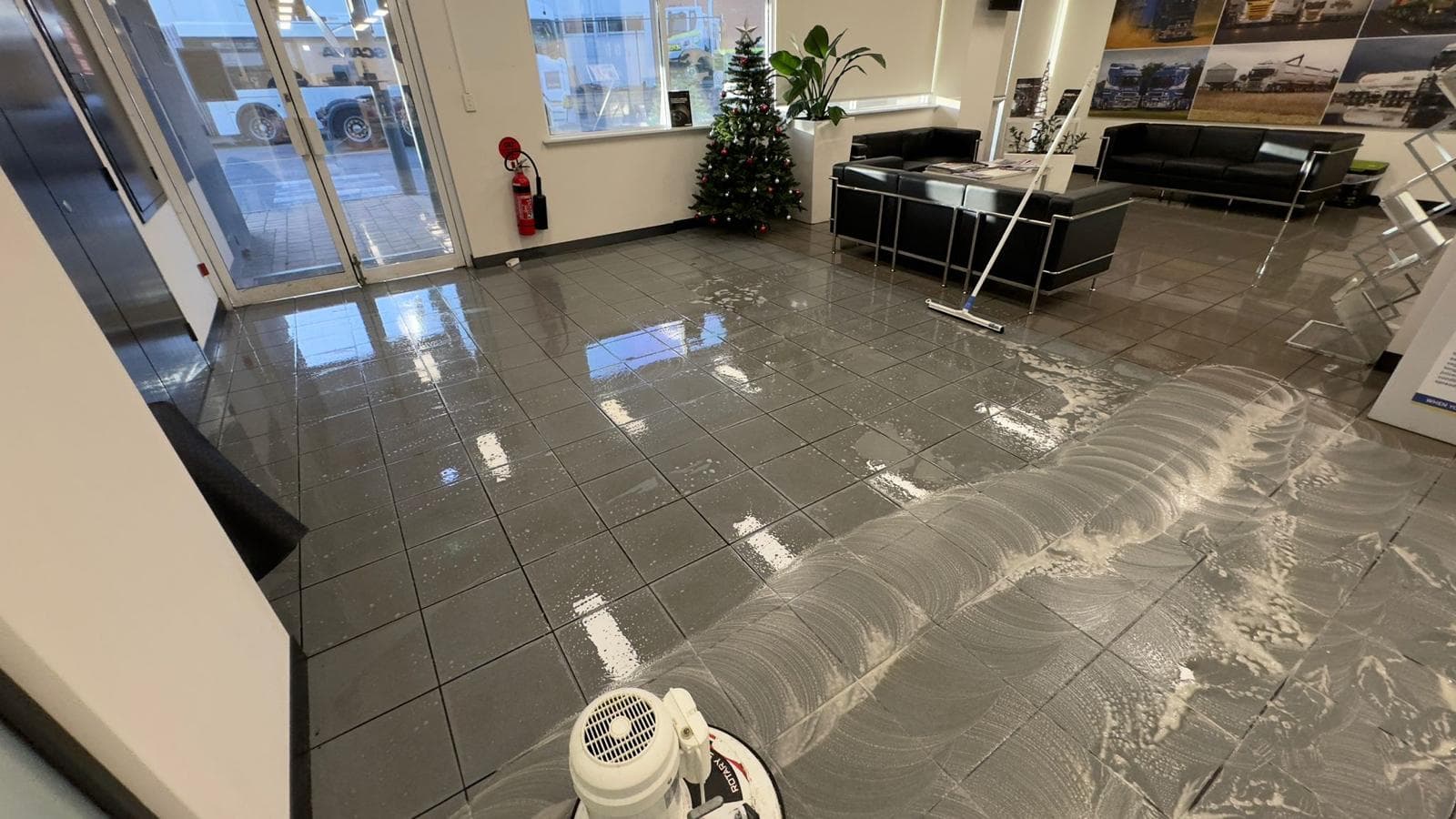 Commercial floor being machine cleaned